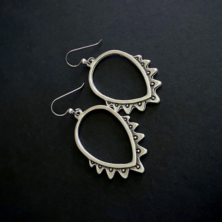 Silver plated, embossed, Ethnic, Boho earrings - Silver plated, embossed, ethnic, Zamak earrings - Niobium & sterling silver hook ear wires - Top of ear wire to bottom of dangle measures 2.5-in - Side to side at widest point measures approximately 1.25-in - Clear rubber stoppers included - Lead and nickel safe *Very pretty and lightweight! Bohemian Teardrop Oxidized Jewelry, Teardrop Oxidized Hoop Earrings As Gift, Teardrop Oxidized Hoop Earrings For Gift, Oxidized Teardrop Jewelry For Festivals, Bohemian Oxidized Teardrop Dangle Earrings, Bohemian Teardrop Oxidized Earrings, Bohemian Teardrop Dangle Earrings With Oxidized Finish, Teardrop Metal Earrings For Festival, Teardrop Earrings With Ear Wire For Festival