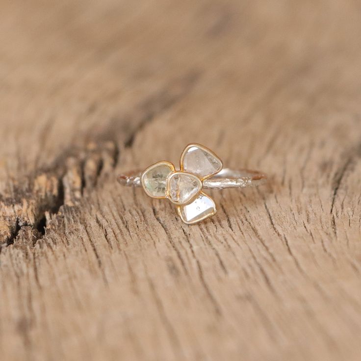 Diamond slice ring. Diamond clover ring.   3  or 4 slices of diamond set in a clover /petal shape.  The petals are gold plated and the texturised band is sterling silver.  So cute and dainty!  -  M A T E R I A L S - 925 Sterling Silver Gold plated  - G E M S T O N E   P R O P E R T I E S -  Diamond: love, strength, prosperity  - S I Z E - Refer to https://pebblesandchance.com/pages/ring-sizing-chart for further information about sizes. Not the right size? Feel free to enquire us about resizing. Delicate Sterling Silver Ring With Single Cut Diamonds, Dainty Sterling Silver Diamond Ring With Rose Cut, Dainty Sterling Silver Ring With Rose Cut Diamonds, Dainty Gemstone Cluster Ring, Delicate Stackable Rings With Diamond Accents, Delicate Crystal Ring With Diamond Accents, Dainty Crystal Open Ring With Rose Cut Diamonds, Delicate Stackable Rings With Rose Cut Diamonds, Dainty Rings With Single Cut Diamonds