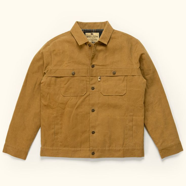 The Laramie, built for the long haul and those up to the task. For snowy ranges, open valleys, and everything in between. Our button-down trucker jacket features double pockets on the sides and chest, as well as an adjustable button-loop waist to ensure the perfect fit. The 100% wax cotton exterior offers reliable protection from the elements, while the interior polyester/cotton blend liner provides dependable warmth. Simply put, the Laramie gets the job done for those who get the job done. *The Cowboy Vintage, Mens Outerwear Jacket, Classic Denim Jacket, Men's Leather Jacket, Dark Khaki, Brown Leather Jacket, Waxed Canvas, Vintage Western, Trucker Jacket