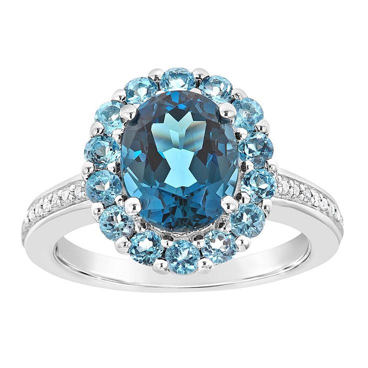 Sterling Silver London and Swiss Blue Topaz Diamond Accent Ring This lovely sterling silver ring features a generous 3.2-carat oval-cut London blue topaz framed in beautiful Swiss blue topaz, while a bevy of round white diamond accents provide the finishing touch.       Approx. 5/8"L x 1/2"W x 1"H; shank 1/16"W     Stamped .925 sterling silver, rhodium plating     Prong-set, oval-cut London blue topaz at center     Center framed with prong-set, round-cut Swiss blue topaz stones     Round, white Blue Topaz Halo Ring For Anniversary, Blue Oval Topaz Ring With Halo Setting, Oval Blue Topaz Ring With Halo Setting, Silver Halo Ring, Blue Topaz Jewelry, Topaz Jewelry, London Blue Topaz Ring, White Diamond Ring, Blue Topaz Stone