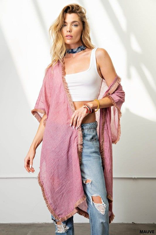 Experience the ease and elegance of our fringe trim kimono. Crafted from a light-weight, soft fabric, this versatile cover-up is perfect for any event. Perfectly suited for dressy occasions and both day and night events, the kimono offers a flattering, loose fit that can be dressed up or down, worn over shorts, jeans, or a beautiful dress. Enjoy the fun and beauty of the fringe trim for an effortless look. Chic Spring Layering Cover-up, Chic Wrap Cover-up For Spring, Long Spring Loungewear Cover-up, Chic Spring Unlined Cover-up, Chic Unlined Spring Cover-up, Spring Cotton Kimono For Beach Cover-up, Spring Wrap Robe For Beach Cover-up, Chic Wrap Cover-up For Loungewear, Spring Wrap Cover-up For Loungewear