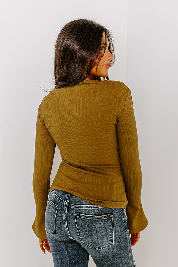 - Give your OOTD a touch of trendy flair with this cutie! - Unlined tight knit material with a ribbed texture - A round neckline - Long bell sleeves - A figure flattering silhouette that ends in a straight hemline Ribbed Solid Stretch Tops, Solid Ribbed Stretch Top, Solid Stretch Ribbed Tops, Stretch Solid Ribbed Top, High Stretch Ribbed Elastane Tops, Trendy Stretch Long Sleeve Top In Elastane, Trendy Stretch Long Sleeve Top, Chic Stretch Knit Top With Ribbed Neckline, Trendy Stretch Elastane Long Sleeve Top