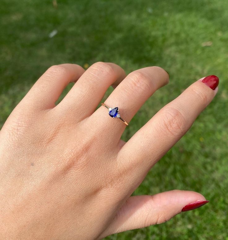 Natutal Pear Cut Blue Sapphire With Diamonds Ring/ Art Deco Blue Sapphire Ring/ Christmas Ring Gift/ Gemstone Engage Ring/ Anniversary Gift This unique  - Blue Sapphire stone is a very special and rare one in our stock which Arya preferred to make it a minimalist design for someone who love dainty rings. This one of a kind and unique SAPPHİRE  Stone attracts luck, success, abundance and prosperity. While giving you the feeling you require, it will fit your other stackable rings and shows your un Fine Jewelry With Birthstone For Proposal, Fine Jewelry Birthstone For Proposal, Fine Jewelry For Proposal With Birthstone, Sapphire Round Cut Jewelry For Proposal, Fine Jewelry Blue Topaz Teardrop Rings, Blue Tanzanite Birthstone Ring, Adjustable Blue Ring With Gemstone Accents, Blue Sapphire Ring With Gemstone Accents For Promise, Tanzanite Sapphire Ring As Gift