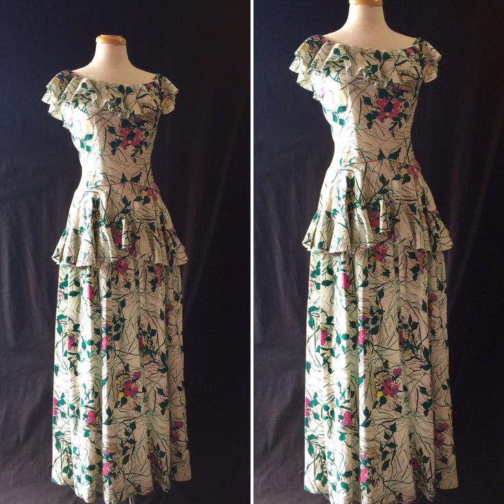 "Great dress! Colors are like original. Classic 40's fitted thru the waist, layers of ruffles at neckline and below the hips. Has a wonderful style. Love this botanical like print, with its dark green leaves. slightly textured cotton. Condition: Excellent, no flaws. More Coming soon... Bust: 40\" Waist: 31\" Length: 58 Shoulders: Arm open: ALL SALES FINAL: If you have any further questions, please don't hesitate to ask! We are more than happy to respond with more images, measurements, etc. Just 1950s Style Ruffled Dresses For Vintage Fashion, Vintage Fitted Dress With Ruffled Skirt, Fitted Vintage Dress With Ruffled Skirt, Retro Vintage Dress With Ruffles And Fitted Bodice, Fitted Vintage Dress With Ruffles, Vintage Dresses With Ruffles And Fitted Bodice, Retro Vintage Dress With Ruffles For Garden Party, Fitted Vintage Dress With Ruffles For Garden Party, Fitted Ruffle Vintage Dress For Garden Party