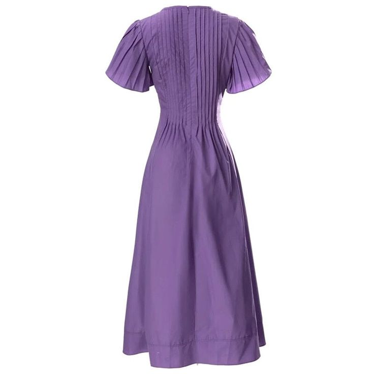 Featuring a premium polyester-cotton fabric blend. open-neck collar. intricate pleated styling and meticulously detailed construction throughout. The "Lavender" short sleeve dress offers unparalleled comfort and styling suitable for any occasion. Arrive with elegance. Standard US/EU Sizing. Designed for style and comfort Open neck collar Back zipper closure Butterfly sleeves Material: polyester. cotton Purple Pleated A-line Dress, Lavender Short Sleeve Formal Dresses, Fitted Short Sleeve Pleated Dress For Spring, Short Sleeve Pleated Dress For Work, Elegant Summer Dresses With Pintucks, Summer Dresses With Pintucks And Short Sleeves, Short Sleeve Formal Dress With Pleated Bodice, Formal Short Sleeve Pleated Dress With Pleated Bodice, Elegant Short Sleeve Purple Dress