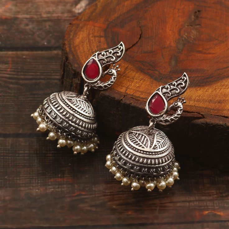 Item  Description - * Material -   Silver plated  oxidized earrings  * Weight   -    20.20 Grams  * Inches.   -    1.5 Inches  * Length.   -  4.0 Centimetre * Width.     -    2.4 centimetre * Pattern.   -   Traditional wear, Party wear, Wedding gift, Daily wear, Casual Wear, birthday gift, anniversary gift ** Best price guaranteed ** We strive continuously to serve our customers better and keep updating our shop with new designs regularly .  We can also supply in wholesale quantities. To enquire Silver Bridal Earrings For Festive Occasions, Silver Danglers For Navratri Party, Silver Danglers For Party And Navratri, Silver Danglers For Party During Navratri, Festive Silver Bridal Earrings, Handmade Silver Metal Jhumkas, Oxidized Finish Earrings For Wedding And Navratri, Festive Silver Chandbalis Drop Earrings, Silver Chandbalis Drop Earrings For Festive Occasion