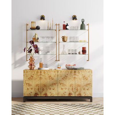 two shelves with vases on them in front of a white wall and checkered floor