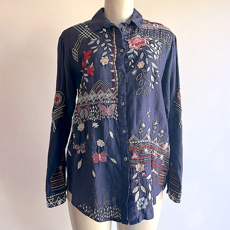 Top Shirt Linen Material Spread Collar Long Sleeve Button Cuff Button Closure Front Flower Pattern Embroidery Excellent Condition Material, Self: 100% Linen Material, Trims: 100% Polyester Style Number: J13021-4 Length From Back: 27.5" - 29" Length From Neckline: 25" - 26.5" Bust: 44" Waist: 45" Hips: 46" Sleeve: 23" Bohemian Embroidered Button-up Shirt, Casual Purple Blouse With Floral Embroidery, Blue Bohemian Blouse With Buttons, Bohemian Blue Blouse With Buttons, Blue Collared Bohemian Tops, Bohemian Shirt With Relaxed Fit And Button Closure, Blue Floral Embroidered Blouse For Work, Bohemian Relaxed Fit Shirt With Button Closure, Blue Floral Embroidery Blouse For Work