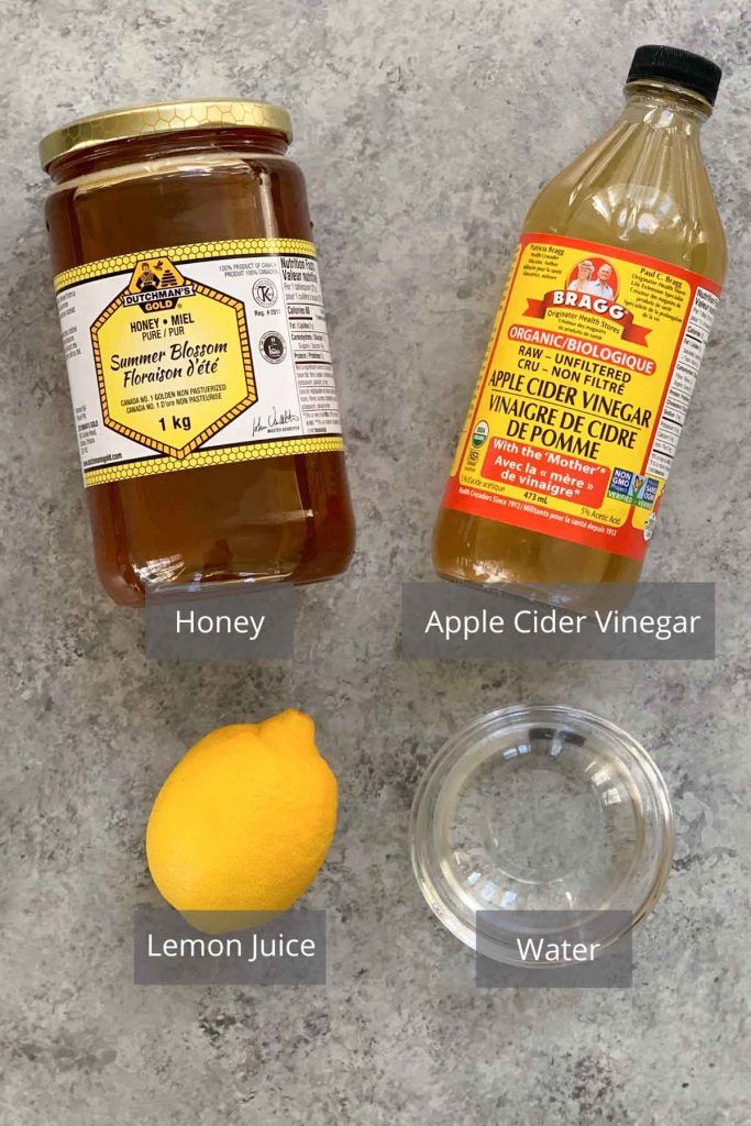 the ingredients to make honey, lemon juice and apple cider vinegar