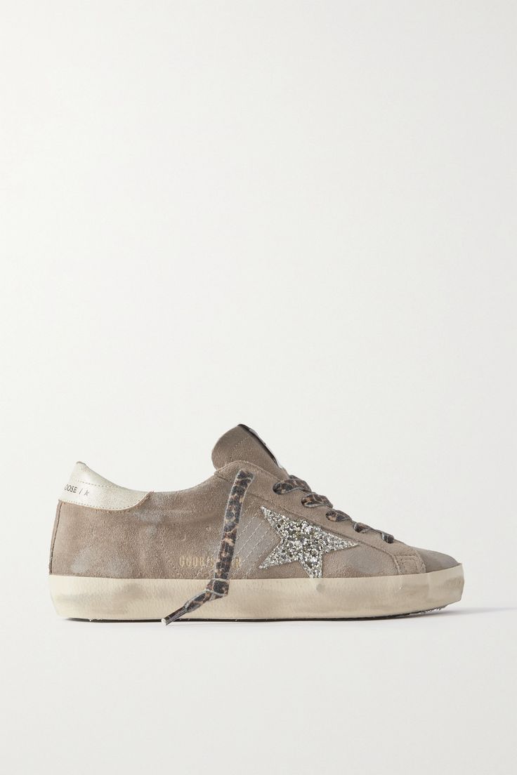 Golden Goose's passion for the imperfect is what sets its designs apart. These leather-trimmed 'Super-Star' sneakers are made from taupe suede, which is distressed and lightened for a uniquely worn-in look. The signature star emblem gets a glittery upgrade, supplying an extra dose of serotonin alongside leopard-print laces. Dressy Sneakers, Simplicity Fashion, Suede Trainers, Golden Goose Sneakers, Golden Goose Shoes, Golden Goose Deluxe Brand, Shoe Inspo, Brown Sneakers, Star Sneakers