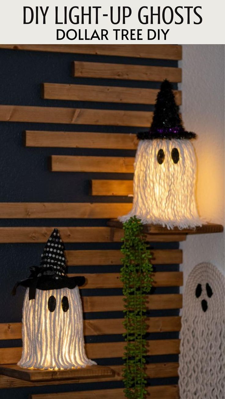 three halloween decorations made out of yarn and plastic ghost heads, with text overlay that reads diy light - up ghosts dollar tree