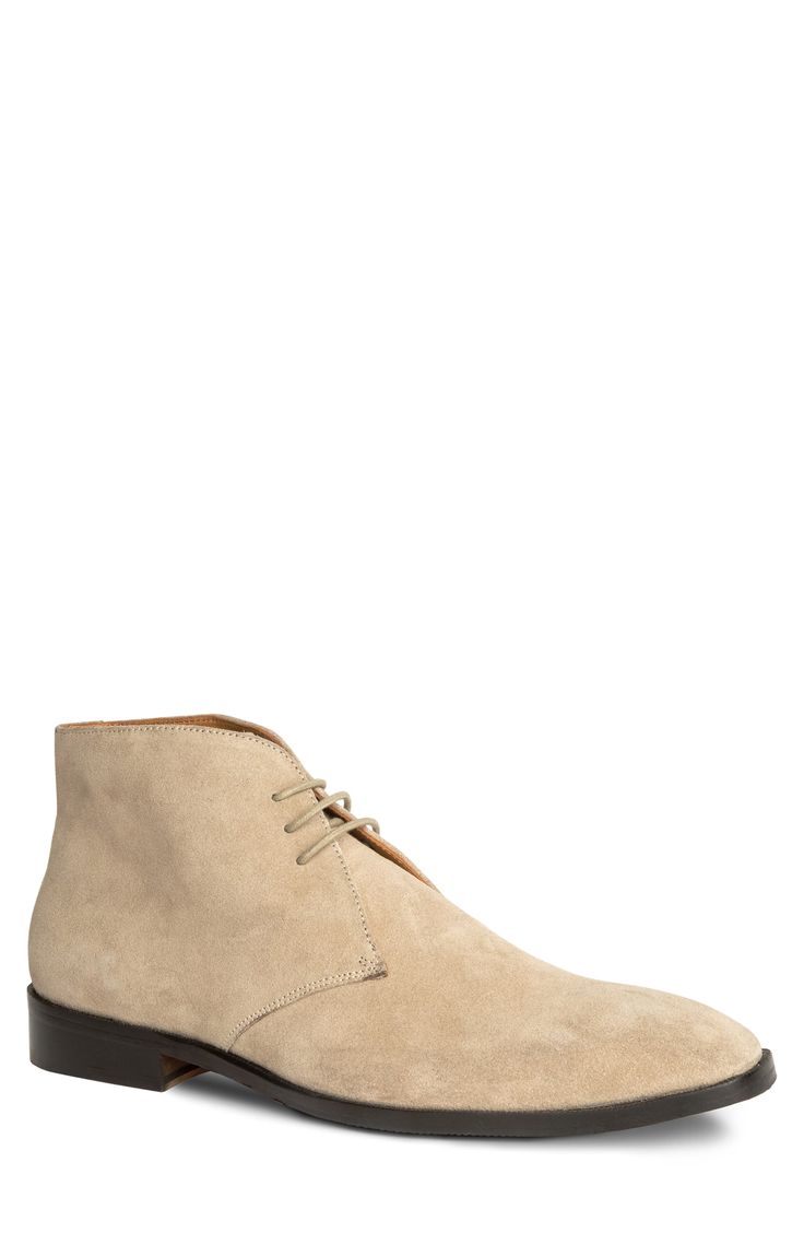 A slightly raised heel adds modern style to a low profile chukka boot crafted from velvety suede and set on a flexible rubber sole. 1 1/4" heel 4" shaft Leather upper and lining/rubber sole Imported Formal Suede Lace-up Boots With Plain Toe, Beige Suede High-top Desert Boots, Beige High-top Suede Desert Boots, Formal Suede Lace-up Boots With Reinforced Heel, Classic Beige Desert Boots With Suede Lining, Classic Beige Suede Desert Boots, Classic Beige Suede Boots, Classic Suede Chukka Boots With Reinforced Heel, Suede Ankle Desert Boots For Business