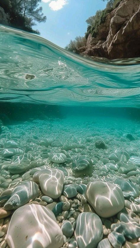 an underwater view of rocks and water