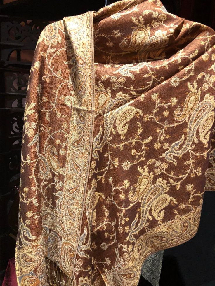 Vintage styled wrap 28 X 70 Nice brocade paisley Very soft silk blend Styled from ancient Jamawar Indian motifs These are replicated from vintage shawl collections by my own company We may have larger quantities available for weddings, bridesmaids, or wholesale orders. Please inquire. All shipped free in the US Please check out our THOUSANDS of great reviews Traditional Brown Pashmina Shawl, Formal Pashmina Shawl In Traditional Drape, Elegant Pashmina Silk Scarf With Traditional Patterns, Elegant Brown Dupatta Traditional Drape, Elegant Brown Traditional Dupatta, Brown Pashmina Shawl With Traditional Drape, Traditional Brown Silk Shawl, Traditional Jamawar Pashmina Shawl For Formal Events, Festive Brown Pashmina Dupatta