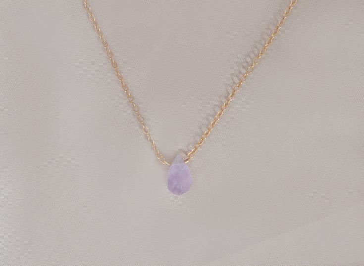 The loveliest gentle purple lavender Cape amethyst is featured on a necklace of sparkling chain, in your choice of sterling silver or 14kt gold filled, and pendant style or attached directly to the necklace chain. This delicately hued drop is ethereally beautiful and will not disappoint. The Cape amethyst necklace arrives presented in a black velveteen jewelry snapbox, ready for gifting. Necklace details: + 14mm cape amethyst faceted drop + High tensile strength 1.3mm cable chain + Spring clasp 14k Gold Filled Spiritual Necklaces As Gift, Spiritual Jewelry With Delicate Chain For Everyday, Spiritual Delicate Chain Jewelry For Everyday, Spiritual Everyday Jewelry With Delicate Chain, Dainty Pendant Crystal Necklace For Her, Dainty Crystal Pendant Necklace As Gift For Her, Dainty Crystal Necklaces For Gifts, Dainty Crystal Necklace For Gift, Dainty Round Crystal Necklace For Gift