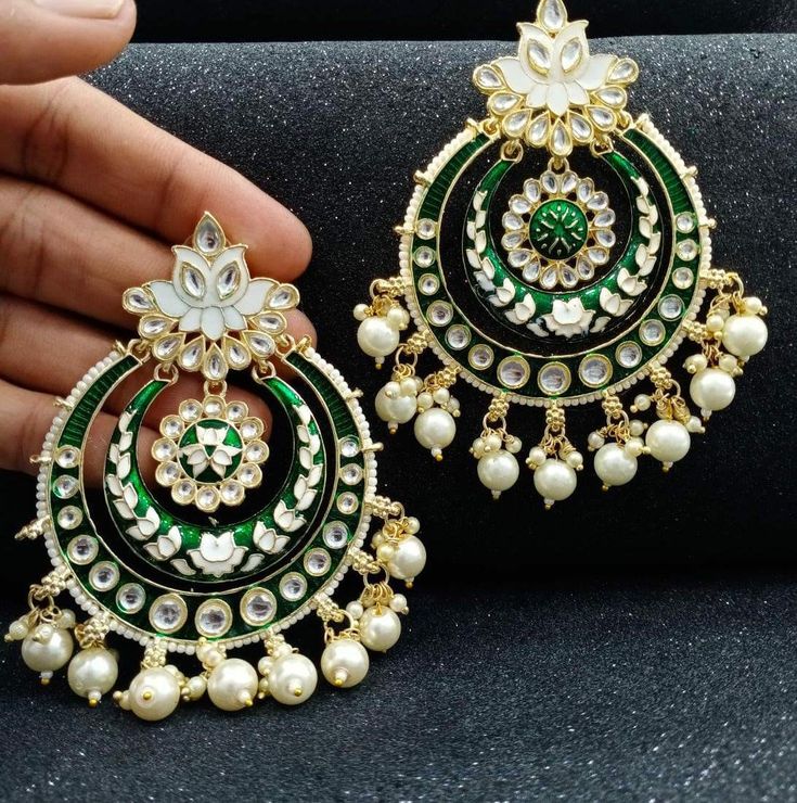 Oversized Meenakari Chandbalis/enamel Kundan Chandbalis. The top of the earrings which sits on the earlobe is flower shape and the dangling part is 2 tiered hoops with Kundan put all around it. The outer most circle is finished with pearls. Bridal Necklace Set, Pearl Bangle, Ruby Stone, Tech Fashion, Green Item, American Diamond, Bridal Necklace, White Ring, Gold Bangles