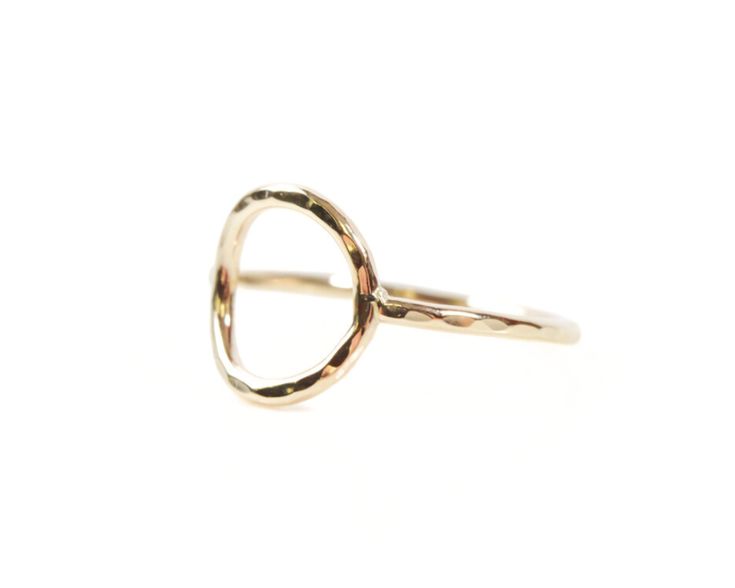 Experience the artistry of simplicity with our Petite Circle Ring, meticulously hand-forged and made to order by our esteemed artisans. This delicate pinky ring not only adds a touch of sweet and simple sparkle but also embodies sustainability in style. Each petite circle, measuring about 7/16” across, is meticulously shaped and receives a delicate hammered texture by the skilled hands of our artisans. This hand-forged process ensures that every ring is a unique masterpiece. Crafted from your ch Everyday Hammered Recycled Gold Rings, Everyday Hammered Open Ring, Dainty Hand Forged Rings For Everyday, Hand Forged Open Ring For Everyday Wear, Dainty Hand-forged Rings In Recycled Gold, Hand Forged Dainty Rings In Recycled Gold, Hand Forged Recycled Gold Dainty Rings, Modern Hammered Adjustable Rings, Hand Forged Modern Everyday Ring