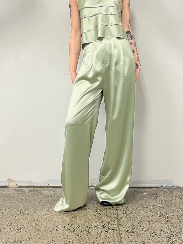 The Paris Pant is a high-waisted, wide-leg pant. Classic & elegant these beautiful pants have a lovely drape with soft front pleats. Love. 100% Triacetate Model is 5'9 and wears a size small High Waist Silk Pants For Spring, High-waist Silk Pants For Spring, Chic Green Satin Bottoms, Chic Silk Wide-leg Bottoms, Chic High Waist Silk Wide Leg Pants, Green Straight Pants For Evening, Chic High-waist Wide Leg Silk Pants, Chic Silk Wide-leg Pants, Elegant High-waist Silk Wide Leg Pants