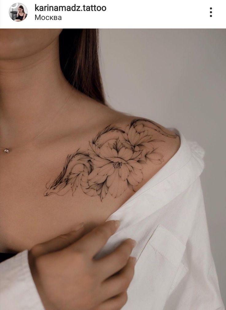 a woman with a flower tattoo on her chest