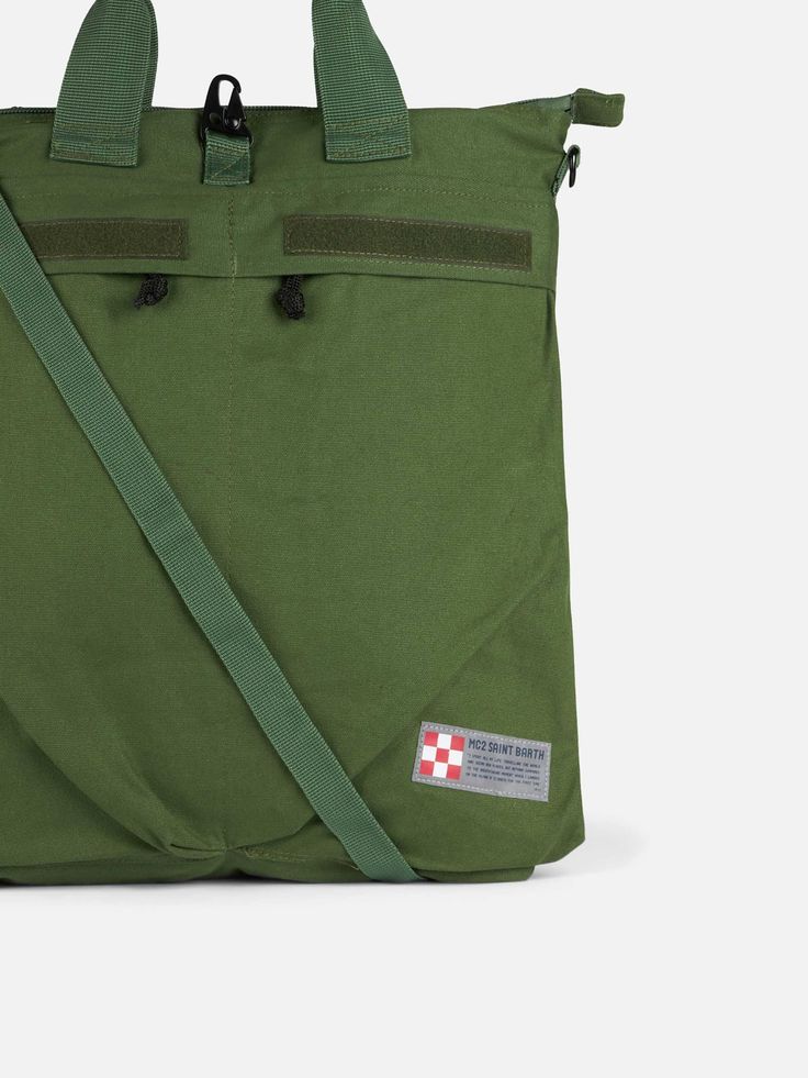 Military green canvas backpackAdjustable shoulder strapsDouble handles for hand transportationLong single strap for cross-body transportationZip closureMC2 Saint Barth front logoMeasures: 50 x 45 x 13 cm Crossbody Travel Bag With Logo Patch, Functional Green Bags With Reinforced Handles, Green Duffle Bag With Adjustable Strap, Green Duffle Shoulder Bag With Adjustable Strap, Functional Green Canvas Shoulder Bag, Functional Everyday Bags With Logo Patch, Green Duffle Bag With Adjustable Strap For Daily Use, Green Rectangular Duffle Bag With Adjustable Strap, Military Style Travel Bag With Adjustable Strap