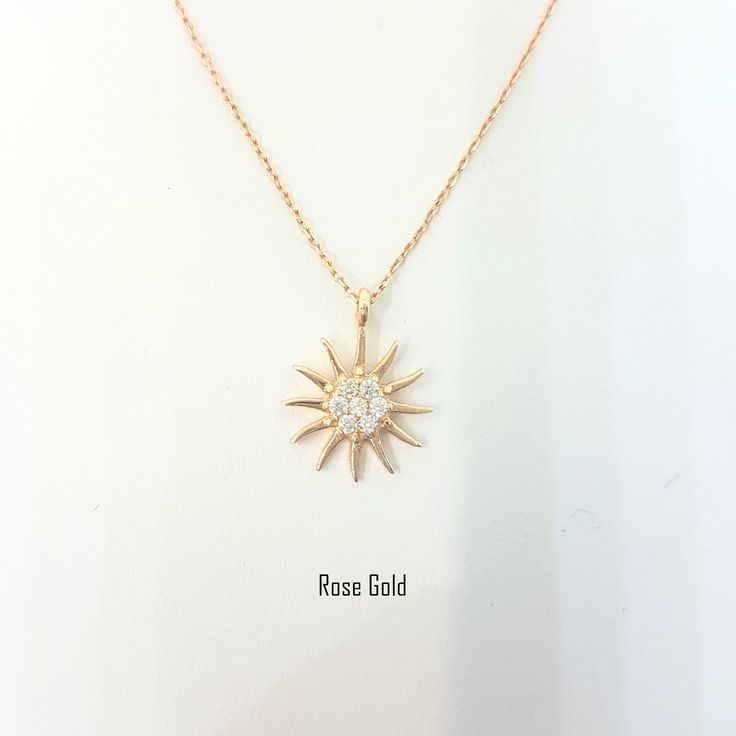 -The sun shaped pendant is made with high-quality 14K solid gold. Also we have listed bracelet and earrings with the same models. So you can combined them. https://www.etsy.com/shop/LatikaJewelryShop - High polish finish and set with flawless cubic zirconia stones. - This dainty, delicate and trendy pendant necklace has been artfully designed for timeless yet modern millennial fashion and you can order in three different colors, yellow , white and rose. - This 14K solid gold pendant comes with a Trendy Pendant Necklace, Gold Sun Necklace, Millennial Fashion, Snowflake Bracelet, Sun Necklace, Artfully Designed, Sun Pendant, Tiny Charm, Handmade Fine Jewelry