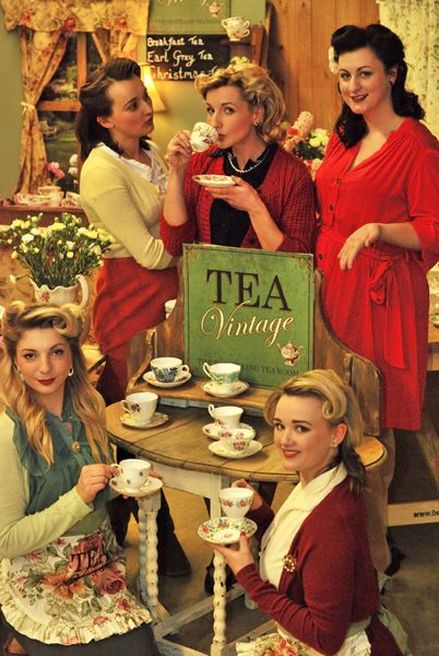 there are many women that are having tea together