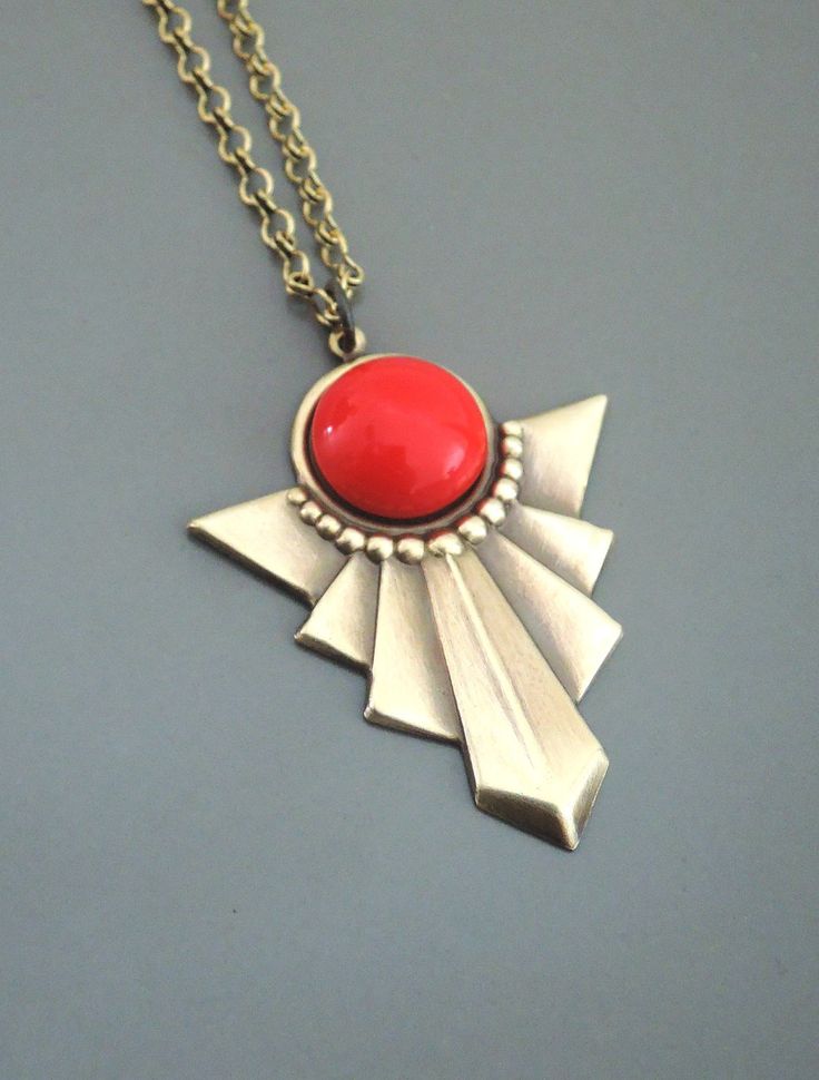 "Vintage Jewelry - Art Deco Necklace - Red Necklace - Vintage Necklace - Pendant Necklace - handmade jewelry This is such a cool! vintage necklace! An Art Deco design pendant embellished with a bright red glass cabochon. The pendant hangs from a pretty vintage brass ladder chain. Chloe says, \"Wear it and feel fabulous!\" This pendant is 1 3/4\" long. You can choose the length you would like at checkout. Thanks for visiting Chloe's" Red Metal Necklace With Large Pendant, Vintage Red Round Pendant Jewelry, Red Large Pendant Jewelry For Gift, Red Jewelry With Large Pendant For Gift, Retro Metal Jewelry For Gifts, Retro Metal Jewelry For Gift, Unique Red Brass Necklaces, Red Round Pendant Necklace, Unique Red Brass Necklace