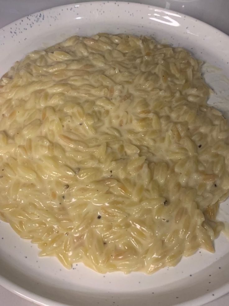 a white bowl filled with macaroni and cheese