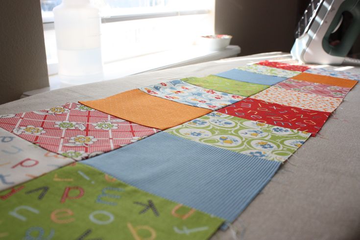 a close up of a quilt on a sewing machine