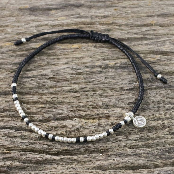 Bohemian chic is where it's at with this bracelet from Thai artisan Samart Takham. The braided cord bracelet is strung with polished beads of 950 silver and accented with a silver charm bearing a leaf stamp from the Karen hill tribe. The adjustable length of the bracelet makes it a comfortable and versatile companion. Diy Braided Bracelet, Black Bohemian, Bohemian Life, Silver Beaded Bracelet, Bohemian Style Jewelry, Black Beaded Bracelets, Gold And Silver Bracelets, Silver Bracelets For Women, Silver Bead Bracelet