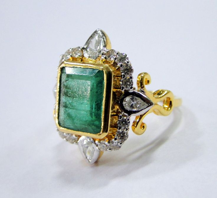 18 K gold Emerald and Diamond set ring. USA ring size-7.5 ( we can adjust size). Size of top-2.2/1.9 cm, weight-7.820 grams, emerald weight-4.36 carats, Diamond weight-1.01 carat. Diamond quality -VS GH Quality. Gold Emerald Cut Hallmarked Emerald Ring, Formal Rectangular Hallmarked Emerald Ring, Vintage Gold Emerald Ring With Rose Cut Diamonds, Rectangular Gold Emerald Ring, Antique Gold Rings With Emerald, Heirloom Style Rectangular Emerald Ring As Gift, Heirloom Rectangular Emerald Ring Gift, Gold Emerald Ring With Rectangular Stone, Rectangular Emerald Ring In Yellow Gold