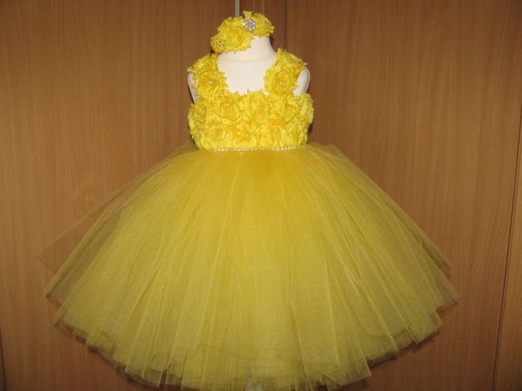 This gorgeous tutu dress is lovingly handmade with close attention to details. 240 yards of soft yellow tulle in this dress make it very full. Pearls are placed in the center of each flower. The shoulder straps are adjustable, ties in the back for a pretty bow! Please select the size according to length (Length measured from armpit to ankle). The crochet top is stretchy and will fit well. Length measured from armpit to ankle *  SIZES: us 0-3 months:dress length-14'' us 3-6  months:dress length-1 Yellow Princess Dress For Birthday In Spring, Yellow Tulle Dress For Birthday, Yellow Tulle Tutu Dress For Wedding, Yellow Princess Style Wedding Dress, Yellow Princess Wedding Dress, Yellow Tulle Tutu Dress For Party, Yellow Tulle Skirt Tutu Dress For Party, Yellow Wedding Tutu Dress With Ruffles, Fitted Yellow Tutu Dress With Tulle Skirt