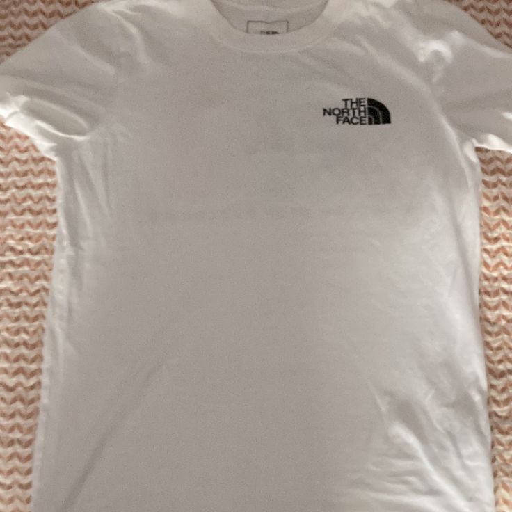 White Tee With Back North Face Logo On Left Chest, Rainbow North Face Graphic Square On Back With “Never Stop Exploring” In Black. Women’s Size Xsmall, But Could Fit A Small/Medium. Brand New. The North Face Cotton Short Sleeve T-shirt, The North Face Cotton Crew Neck T-shirt, Simple White Tops With Graphic Print, The North Face Relaxed Fit Top For Streetwear, Simple White Top With Text Print, Simple White Tops With Text Print, The North Face Cotton Graphic Tee, The North Face Crew Neck Top With Letter Print, The North Face Letter Print Streetwear Tops