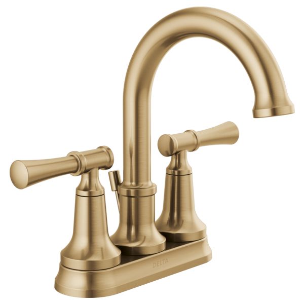 an antique brass faucet with two handles