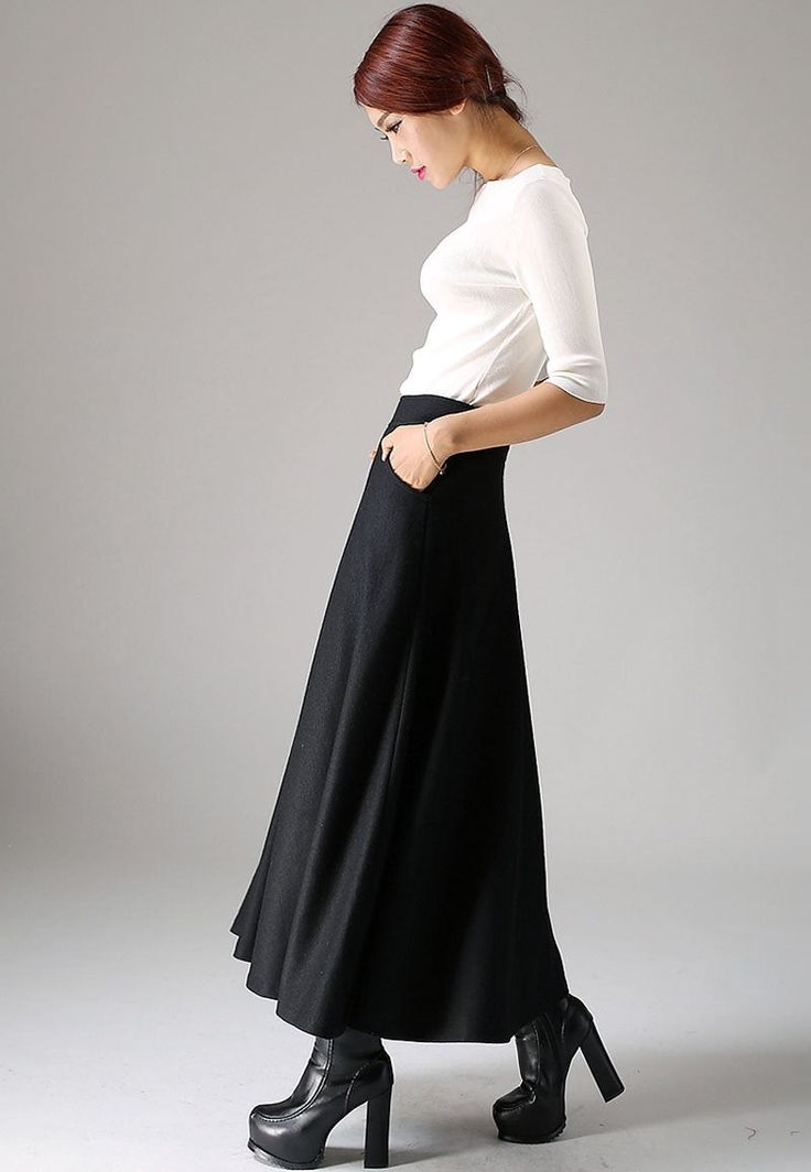 "Look elegant and stylish at all times and for any occasion in this long black classical A-line skirt. This flared women skirt with double stitching detail at hip pockets oozes understated sophistication. This very versatile winter skirt can be worn casually with knitwear or more formally with a crisp white blouse.This is a timeless investment piece you'll have in your wardrobe for years to come. Choosing black makes it so easy to pair with a variety of blouses and jackets. Scientific studies ha Classic Black A-line Skirt, Black A-line Maxi Skirt For Winter, Classic A-line Maxi Skirt For Formal Occasions, Elegant A-line Bottoms For Winter, Elegant A-line Fall Skirt, Black Relaxed Classic Maxi Skirt, Classic Black Relaxed Maxi Skirt, Classic Black Flared Maxi Skirt, Classic Relaxed Black Maxi Skirt