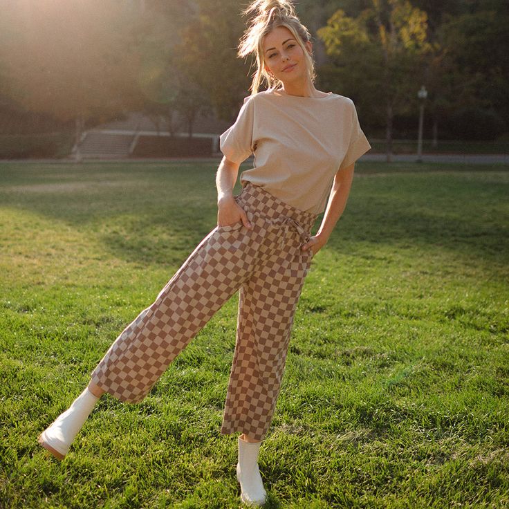 Wide legged, checks for the win! Style up with some signature boots or keep it casual with your favorite sneakers. Bonus: Neutral tones make this easy to pair with anything in your closet! Wide-legged Slightly cropped length 3" Waistband with adjustable drawstring Front & back pockets Available in tall and petite sizes Paired with our Basic Tee, Bamboo White and Denim Jacket, our Navy Atlas Ribbed Sweater, and our matching Boss Crop Tee, Cobblestone! FREE U.S. Standard Shipping! More info hereMo Casual Plaid Pants For Spring, Casual Gingham Relaxed Fit Bottoms, Casual Gingham Bottoms With Relaxed Fit, Casual Gingham Ankle-length Pants, Casual Plaid Bottoms For Spring, Casual Plaid Bottoms For Fall, Casual Plaid Bottoms With Relaxed Fit, Casual Plaid Pants For Fall, Casual Gingham Wide Leg Bottoms