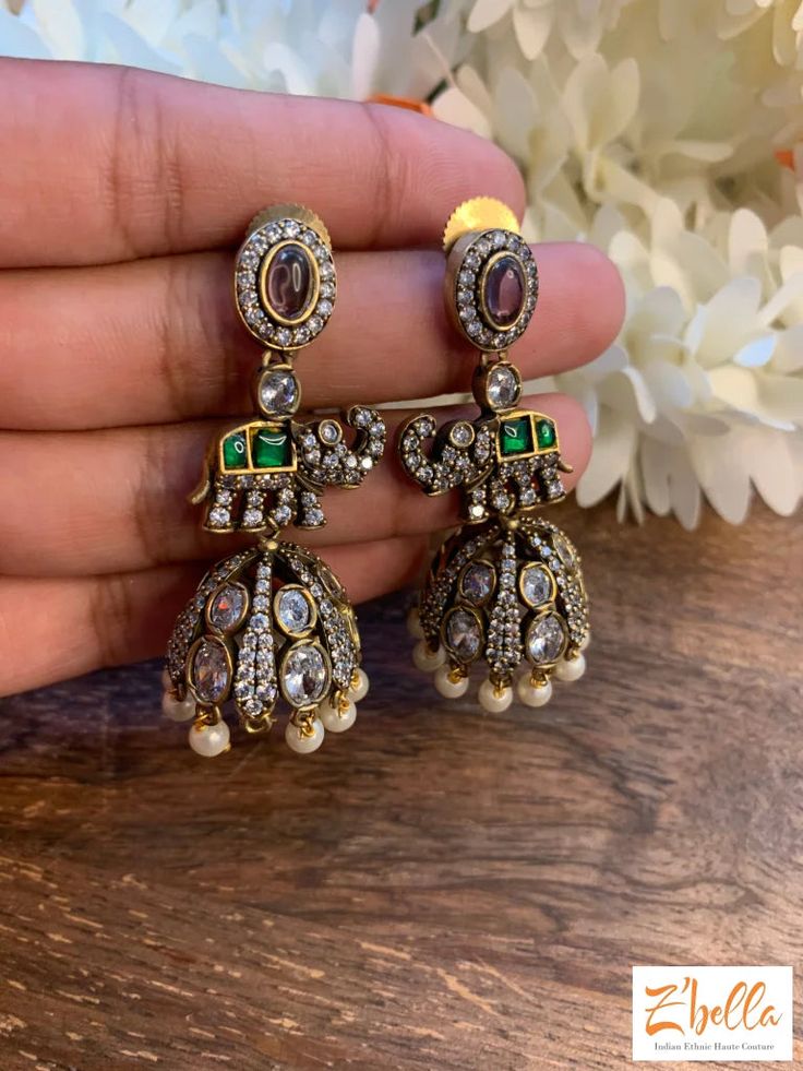 Victorian Finish Jhumka With Kundan And Green Stone Earrings Gold Tone Gold Kundan Jhumkas For Festivals, Heavy Brass Chandbali Earrings, Heavy Brass Chandbalis, Festive Bollywood Chandbalis In Brass, Festive Stone Work Temple Jewelry Jhumkas, Festive Temple Jewelry Style Stone Work Jhumkas, Bollywood Style Brass Chandbalis As Gift, Heavy Brass Jhumkas For Wedding, Festive Temple Jewelry Jhumkas With Stone Work