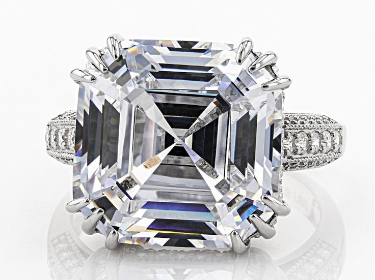 Bella Luce ® white diamond simulant 23.95 ctw asscher cut and round, rhodium over sterling silver ring. Measures approximately 0.81" L 0.56" W and is not sizeable. The diamond equivalent weight is 13.11 ctw. Diamond White Octagon Cubic Zirconia Ring, Fine Jewelry Asscher Cut For Formal Occasions, Formal Octagon Brilliant Cut Jewelry, Octagon-shaped Diamond Ring With Accents For Gifts, Octagon Diamond Ring With Accents For Gift, Octagon Diamond Ring With Diamond Accents, Octagon Diamond Ring With Diamond Accents As Gift, Dazzling Octagon Diamond Cut Jewelry, Formal Octagon Diamond Ring With Accents