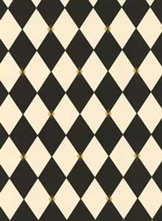 a black and white checkered pattern with gold dots