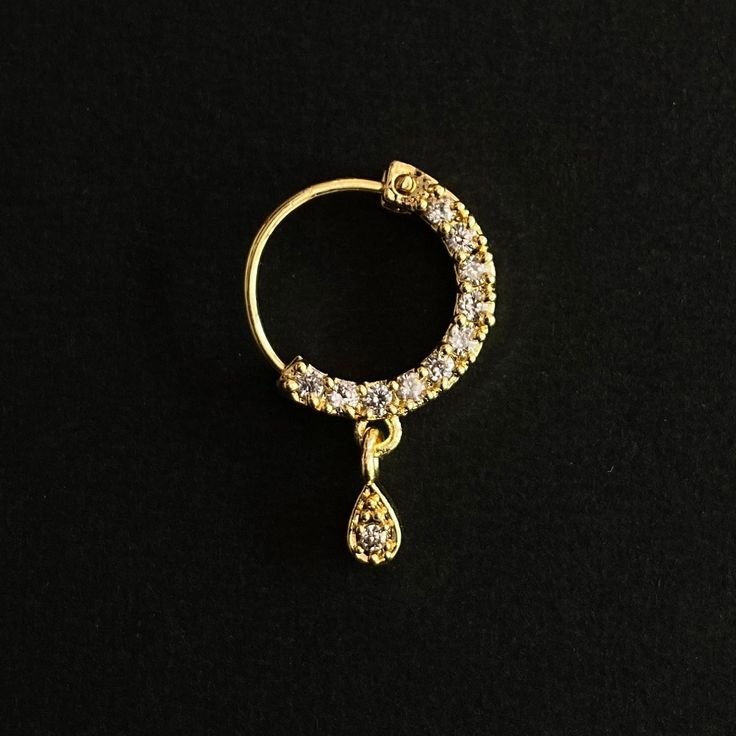 Name of Product: Bridal Traditional Jewelry Indian Antique Nose Ring. It requires a hole in the nose ( piercing is required ) Unfortunately no exchanges /refunds due to hygiene reasons Diameter: 1.3/1.5/1.8/2.4 Centimeter Platting: Gold Material: Copper Piercing: Left Side To view our latest collection of Nose rings / Nath please click the below link. https://www.etsy.com/uk/shop/HemrajJewellers?ref=seller-platform-mcnav§ion_id=30100702 Jewelry care instructions : 1. Please wipe the jewelry with Desi Nose Ring Aesthetic, Latest Gold Nath Designs For Bride, Indian Nose Ring Hoop, Gold Nose Jewelry, Gold Nath, Bridal Nath, Nose Ring Designs, Nose Ring Indian, Nose Ring Gold