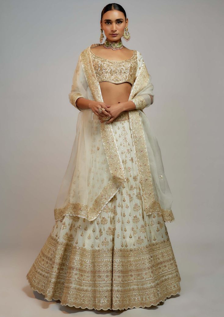 Gopi Vaid-White Shahi Lehenga Set-INDIASPOPUP.COM Reception Sharara With Zari Work, Wedding Sharara In Raw Silk With Gold Embroidery, Raw Silk Sharara With Zari Work For Reception, Semi-stitched Choli With Gold Embroidery For Reception, Semi-stitched Lehenga With Gold Embroidery For Reception, Anarkali Style Gold Lehenga With Intricate Embroidery, Traditional Lehenga With Gold Embroidery For Reception, Gold Lehenga In Raw Silk With Resham Embroidery, Gold Lehenga With Intricate Embroidery In Traditional Drape