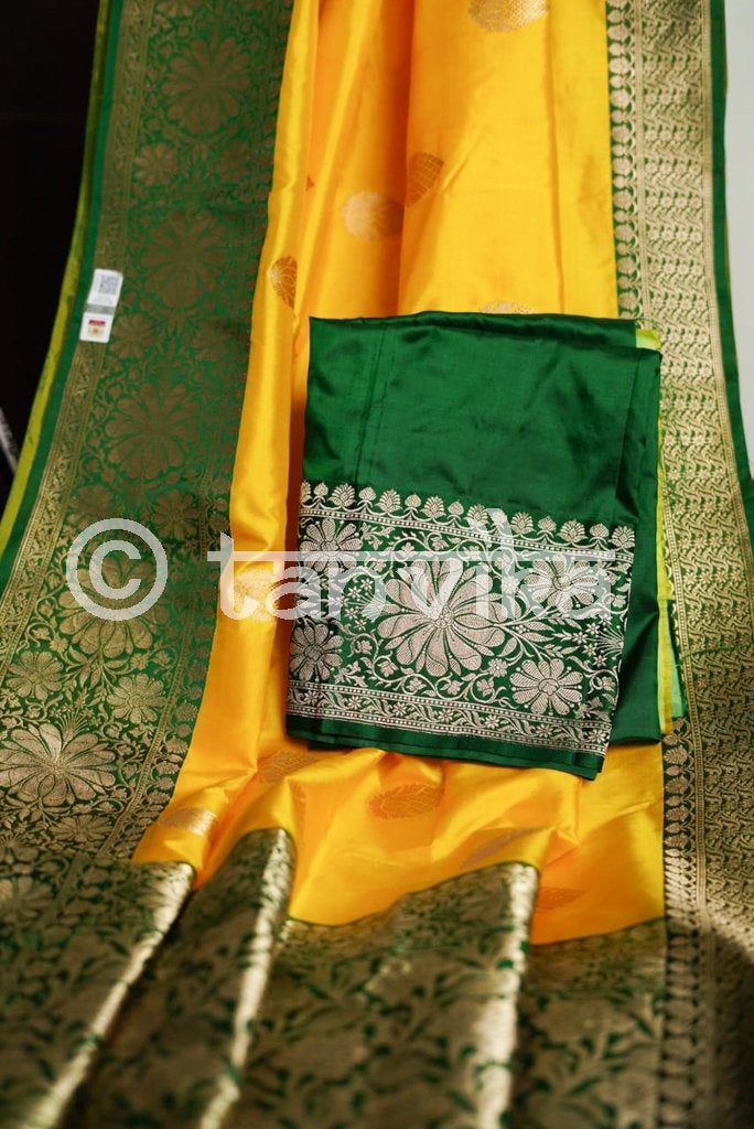 An exquisite Banarasi in spectacular combination of Yellow and green with incredible zari work on the elegant motifs on the body, border, and pallu, handwoven on resplendent pure Katan silk. These rustling silks with tapestry-like motifs in their glistening accents are rooted deep in tradition and dipped in regality. The super smooth and soft fabric makes it an absolute delight to drape and carry for occasions like festivals, pujas, celebrations, parties, weddings, etc. A must-have unique Saree Pista Green Silk Anarkali Set With Pallu, Silk Anarkali Set In Pista Green With Pallu, Green Silk Churidar With Traditional Drape, Green Tussar Silk Set With Dupatta, Green Silk Salwar Kameez With Cutdana, Traditional Green Anarkali Set With Cutdana, Green Raw Silk Churidar With Zari Work, Green Zari Work Tussar Silk Traditional Wear, Green Tussar Silk Traditional Wear With Zari Work