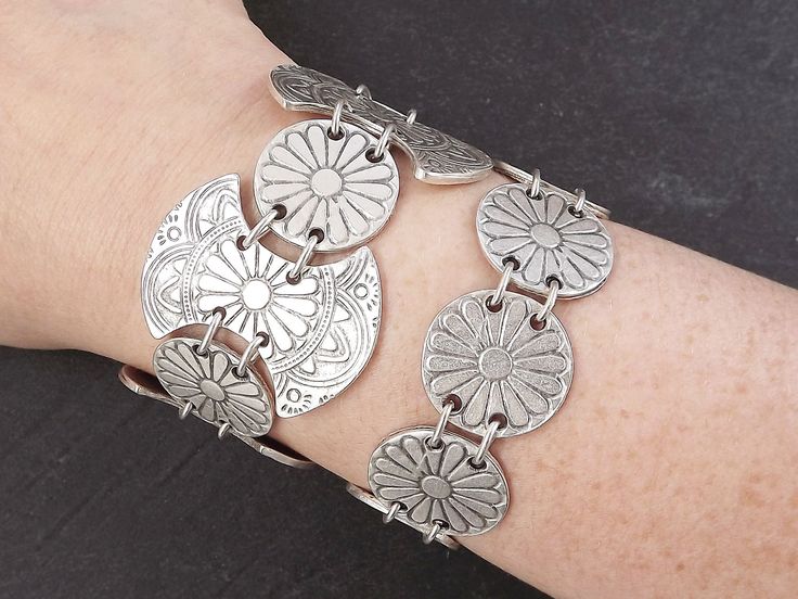 Inspired by the Ottoman Turkish style jewelry, this ethnic bracelet was made with lovely daisy detailed discs and finished off with a chain and lobster clasps making it adjustable to suit any wrist size. Size: 24.5cm (from clasp edge to end of chain with charm) x 4cm (deep) Lovely and comfortable to wear. This bracelet is sterling silver plated with an antique oxidized finish. Our all products are lead, nickel, cadmium free. Your item will be gift wrapped and shipped via registered Air Mail with Turkish Style, Metal Clay Jewelry, Clay Bracelet, Turkish Fashion, Art Clay, Chain Silver, Daisy Chain, Statement Bracelet, Metal Clay