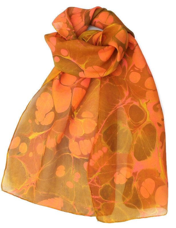 Gold ochre, yellow, orange and pink marbled silk scarf. It can be used as a neck scarf or headband. The fabric is called pongee. It's a very soft, lightweight, 5mm, semi transparent, 100% silk.  Marbling is an centuries old craft originating in Asia. Colours are floated upon a solution, manipulated with various tools and then transferred to fabric, paper or wood. The resulting designs are free-flowing, unusual and can resemble many organic patterns. Of course no two patterns will be exactly the Orange One Size Scarves, Pink Hand-dyed Scarf, Silk Orange Scarves As A Gift, Silk Orange Scarves As Gift, Orange Silk Scarf For Summer Gift, Orange Silk Scarves As A Gift, Orange Silk Scarves As Gift, Handmade Silk Scarf For Summer, Brown Silk Scarf For Summer