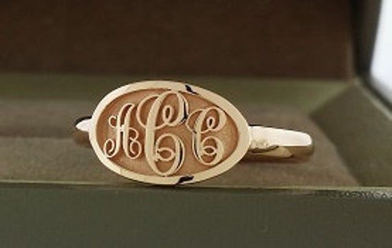 Monogram ring made in solid 14k gold. Provide your initials in order from left to right in the notes section during checkout or through ask me a question. 1.Material - 14K solid gold (585) 2.Stone - none. 3.Dimension - top of ring is approximately 13x8 mm 4.Ring size - contact me for ring sizes not listed in the drop down list. This is made to order and will take about 3 weeks to finish. I use lost wax casting process. Some pictures are professionally computer rendered and the finished product w Elegant 14k Gold Engraved Initials Ring, Engraved Initials Promise Ring In Rose Gold, Rose Gold Sterling Silver Rings With Initials, Signature 14k Gold Jewelry With Initials, Engraved 14k Rose Gold Ring With Polished Finish, Luxury Engraved Rose Gold Signet Ring, Rose Gold 14k Gold Rings With Initials, Classic Rose Gold Initial Ring With Polished Finish, Formal Rose Gold Engraved 14k Gold Ring