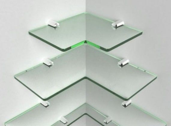 three glass shelves stacked on top of each other in the shape of an upside down triangle