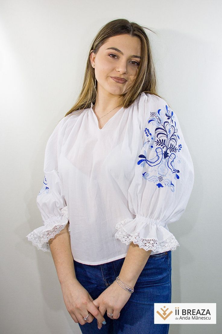 Embracing the symbolism and beauty of nature, this embroidered blouse takes you into the enchanted world of the tree of life and birds. The refined embroidery in shades of blue brings a special charm and a fairy-tale atmosphere to each stitch. At the center of the blouse shines the tree of life, a symbol of wisdom, growth, and connection to the world. The tangled branches and delicate leaves create an image full of life and vitality, bringing a touch of mystery and profound significance to each Blue Folk Style Embroidered Long Sleeve Top, Blue Embroidered Top With 3/4 Sleeves, White Folk Style Embroidered V-neck Top, Blue Peasant V-neck Top, Embroidered Bohemian Off-white Blouse, Ordinary Day, Birds Flying, Embroidered Blouse, Tree Of Life