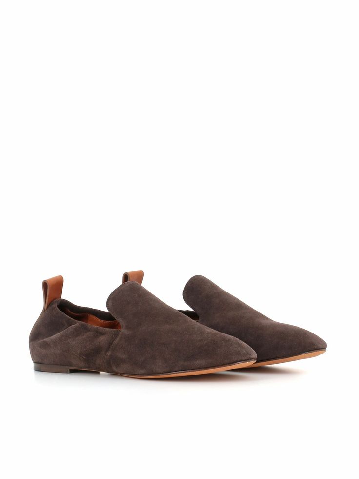 Dark brown soft suede slipper by Lanvin, featuring by a back label with cigar color Lanvin logo. Lined interior. 15 mm high padded insole. Heel: 1 cmComposition: Suede Brown Suede Slip-ons With Leather Sole, Brown Suede Slip-on Slippers, Brown Suede Loafers With Flat Heel, Brown Suede Flat Heel Loafers, Classic Brown Slippers With Suede Lining, Luxury Brown Slippers With Leather Sole, Brown Slip-ons With Suede Lining, Brown Suede Loafers With Suede Lining, Brown Suede Slip-on Loafers