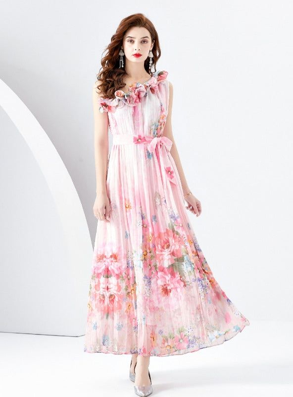 Beguiling in its ethereal beauty, this sleeveless maxi dress is a masterpiece of artful prints and soft, flowing fabric. The whimsical pattern evokes a dreamlike cityscape, enriched with vibrant splashes of color that mimic the transient beauty of a sunset skyline. The high neckline is graced with delicate ruffles, lending a romantic air to the overall design. A sash cinches the waist, offering a flattering silhouette, while the lightweight material dances around the ankles, perfect for an eveni Pink A-line Maxi Dress With Floral Print, Multicolor Printed Chiffon Maxi Dress, Printed A-line Maxi Dress For Garden Party, Flowy Multicolor Floral Print Sleeveless Dress, Bohemian Sleeveless Chiffon Midi Dress, Multicolor Chiffon Maxi Dress For Garden Party, Elegant Multicolor Maxi Sleeveless Dress, Floor-length Sleeveless Dress For Beach Spring, Spring Floor-length Sleeveless Beach Dress