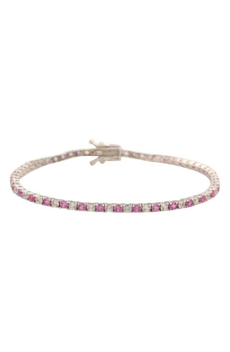 Sparkling white and pink sapphires dazzles your wrist on this simply stunning bracelet crafted from sterling silver. Sterling silver/white sapphire/pink sapphire Imported Formal Pink Bracelets With Diamond Accents, Elegant Pink Sterling Silver Round Bracelet, Pink Diamond Jubilee Bracelet For Anniversary, Pink Bracelets With Diamond Accents For Gift, Pink Bracelets With Diamond Accents As A Gift, Pink Jubilee Round Tennis Bracelet, Pink Sterling Silver Round Bracelet, Classic Pink Tennis Bracelet With Jubilee Design, Classic Pink Tennis Bracelet With Jubilee Style